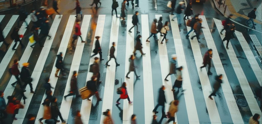 People crossing a busy intersection